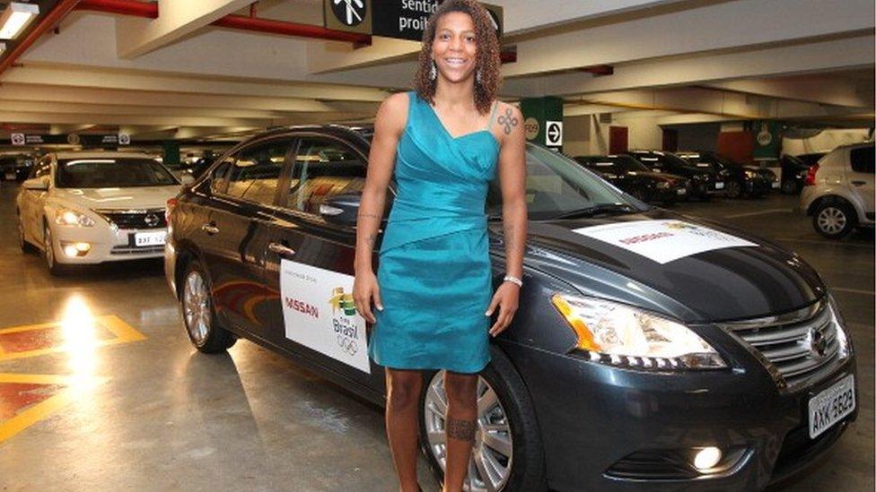 Rafaela Silva, Judo athlete, in front of a Nissan car with Olympic logos