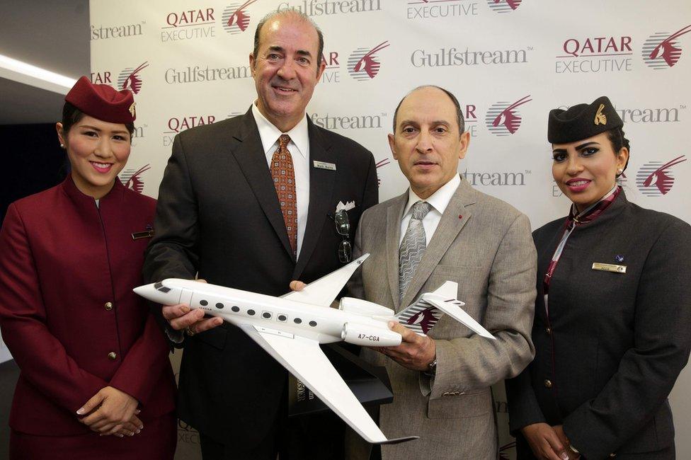 President of Gulfstream Aerospace, Mark Burns (2nd L) and Chief Executive Officer of Qatar Airways, Akbar Al Baker (2nd R)