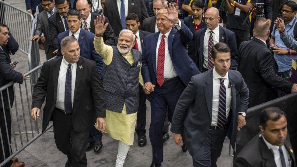 Narendra Modi and Donald Trump leave the stage holding hands at NRG Stadium, Houston