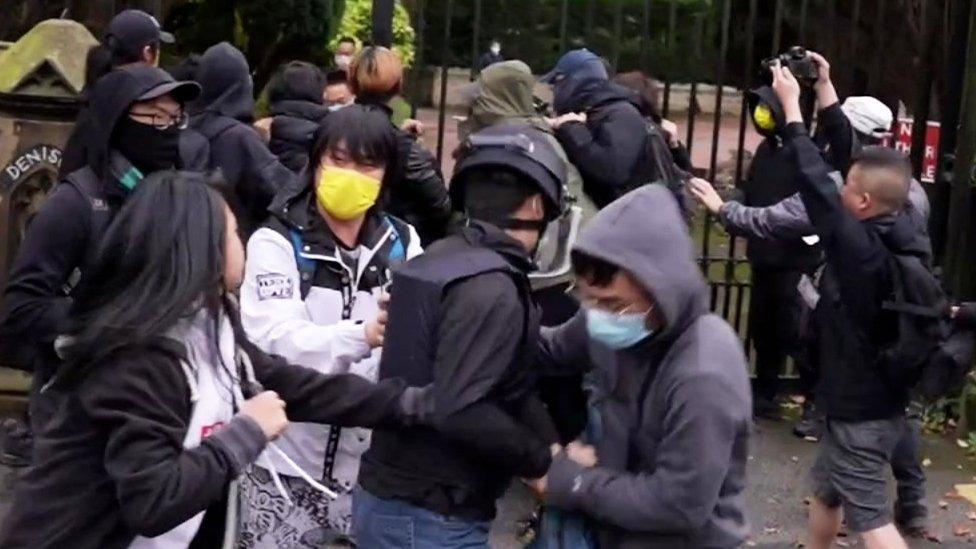 A still from a video shows a scuffle outside the consulate