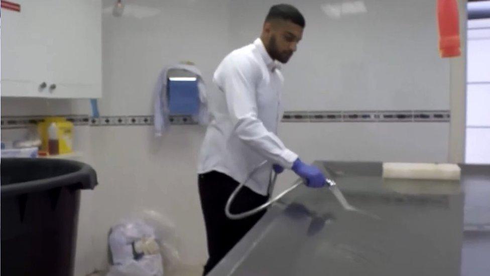 Volunteer Adam Hussain helped prepare a backlog of bodies for burial