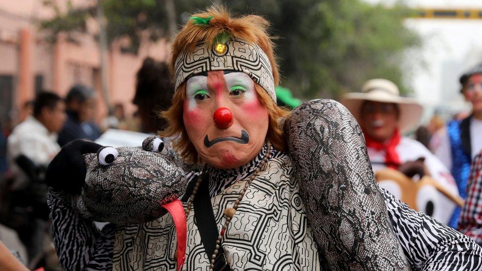 Clown takes part in a parade during Peru's Clown Day celebrations in Lima, Peru May 25, 2018