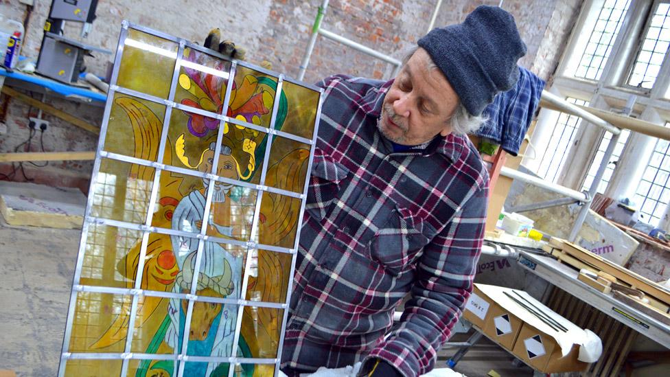 Bob Wall showing a new stained glass window for Hopwood Hall