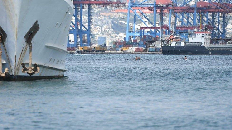 Rowers next to the port