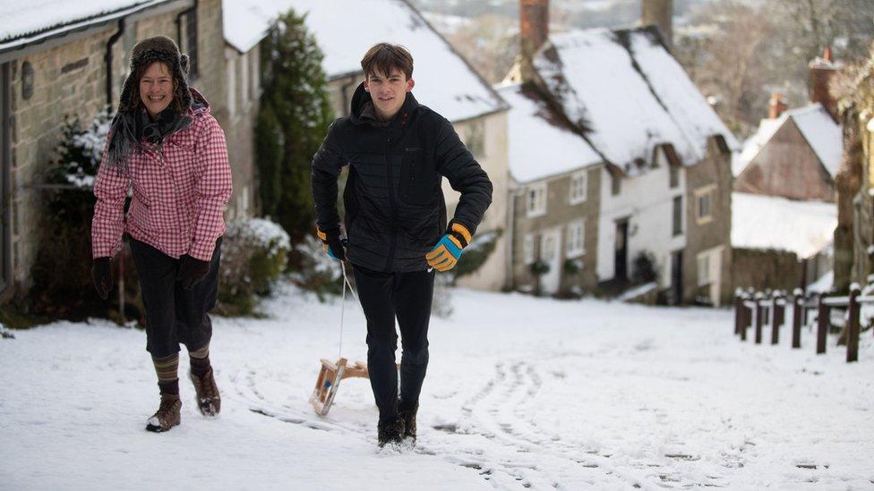 People sledging on Gold Hill in Shaftesbury Dorset - Andrew Matthews PA Wire