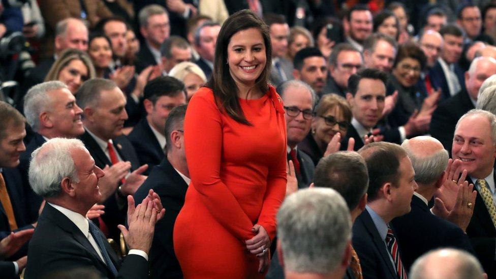 Elise Stefanik rises after being acknowledged by Donald Trump for her work on his impeachment trial