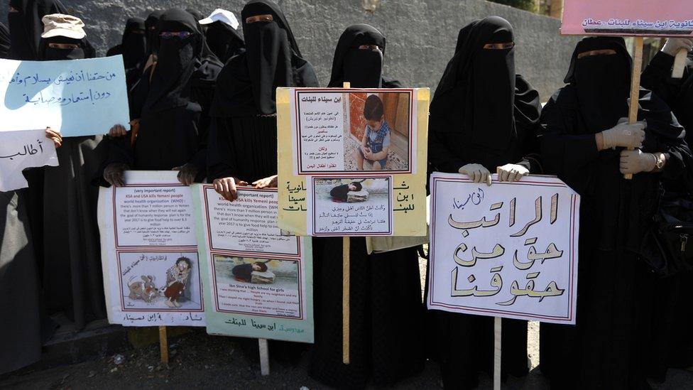 Yemeni female teachers and their children attend a protest against the conflict and the suspension of their monthly salaries, outside the UN offices in Sanaa, Yemen