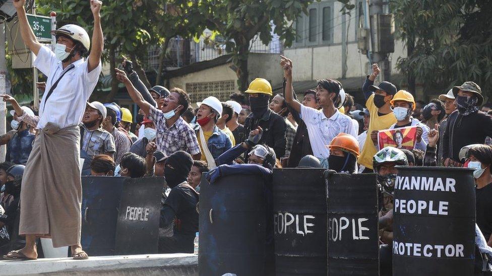 Demonstrators shout slogans as they gather on the street during an anti-coup protest in Mandalay, Myanmar, 05 March 2021.