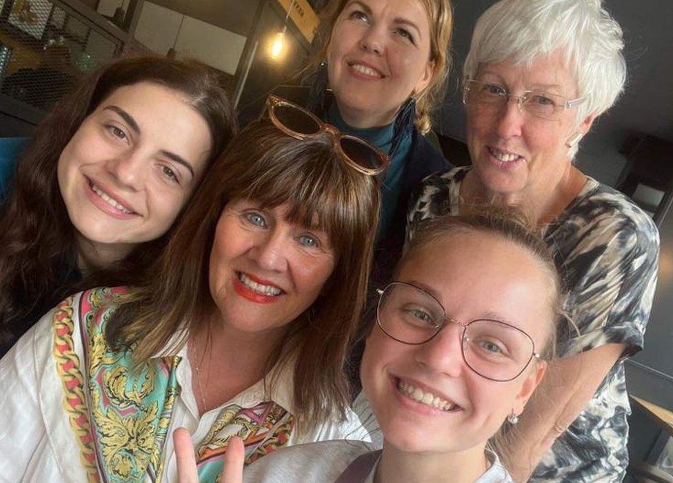 Lorraine Ferguson (centre) has matched hundreds of Ukrainians with NI host families