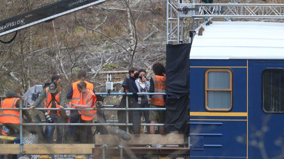 Tom Cruise on train with film crew