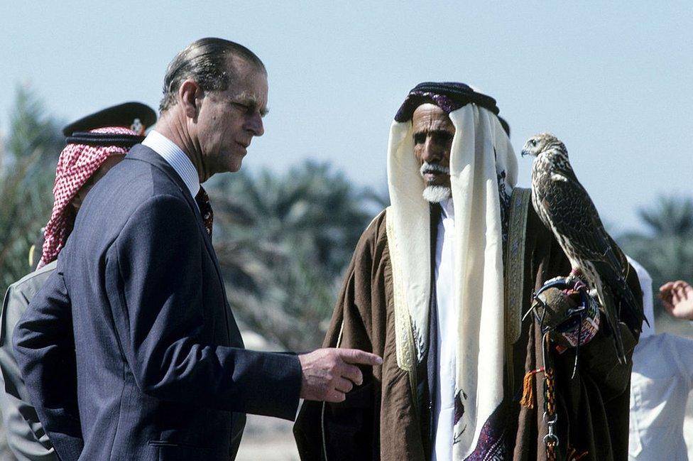 Prince Philip, Duke of Edinburgh looks at a hawk during a visit to Bahrain in February 1979 in Manama, Bahrain.