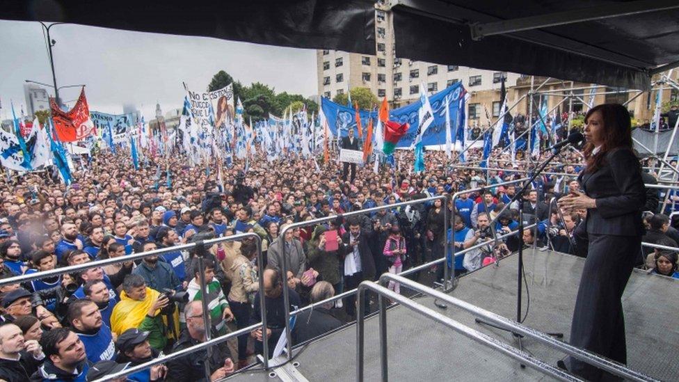 Argentine former president Cristina Fernandez de Kirchner delivers a speech before supporters gathering in front of the Comodoro Py courthouse where she testified before federal judge Claudio Bonadio over corruption allegations, in Buenos Aires on April 13, 2016.