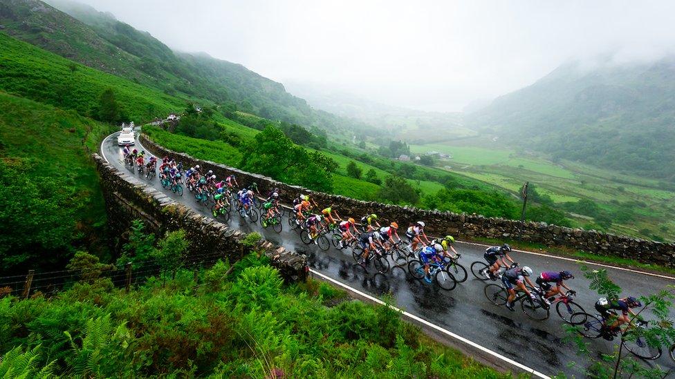 cyclist riding along a country road in Wales