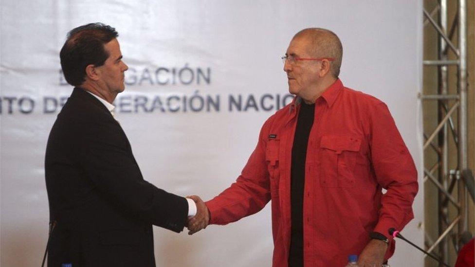 The leader of the ELN negotiation team Antonio Garcia (R) shakes hands with Colombian Government negotiation chief Frank Pearl (L) during a press briefing announcing the beginning of peace talks, at the Venezuelan Foreign Ministry facilities, in Caracas, Venezuela, 30 March 2016.