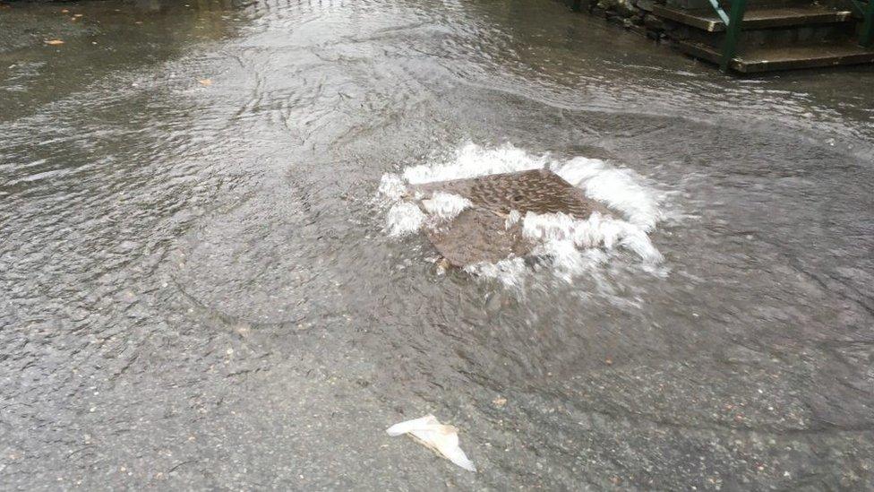 Sewage flooding from manhole