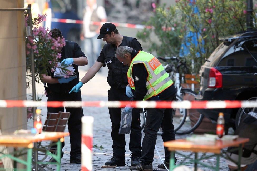 Investigators at the bomb scene in Ansbach, 25 July