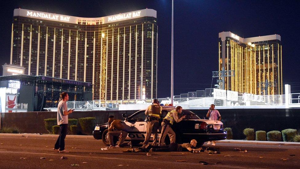 People hid behind cars to shelter from gunfire