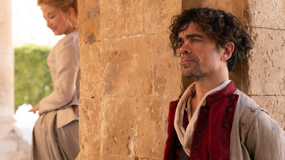 Haley Bennett stars as Roxanne and Peter Dinklage as Cyrano in Joe Wright’s Cyrano