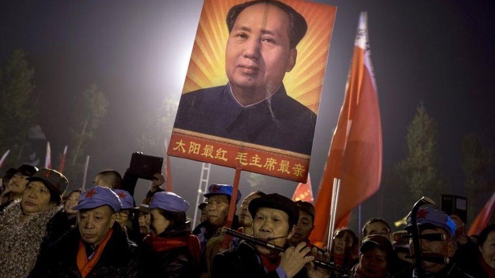 Fans of late Chinese leader Mao Zedong gather for a celebration on the eve of what would have been his 122nd birthday in his hometown of Shaoshan in southern China's Hunan province (25 December 2015)