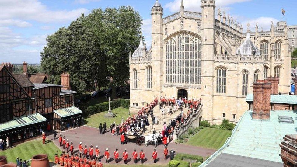 The Knights of the Garter, guards, military and members of the Royal Family surround the west steps at St George's Chapel