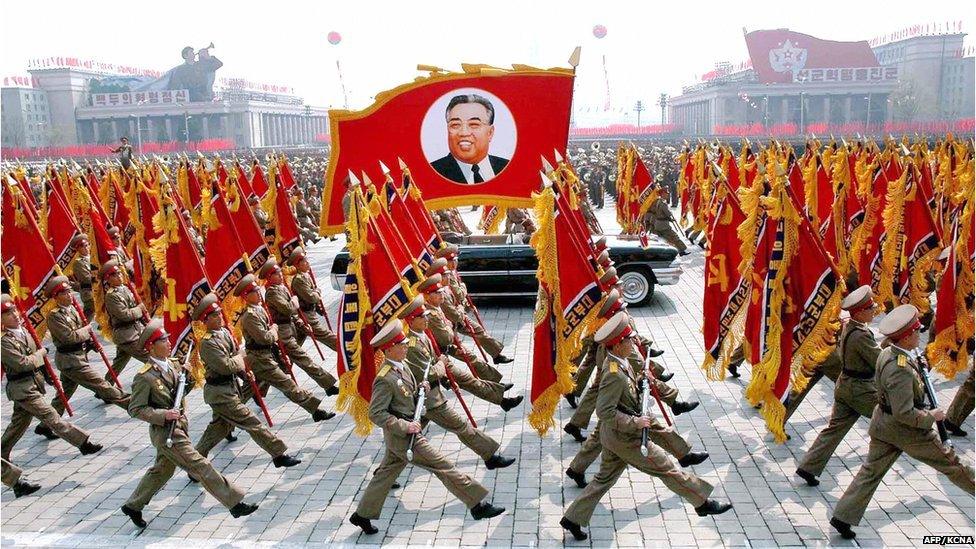 This 25 April 2007 picture, released from Korean Central News Agency 26 April, shows North Korean soldiers, carrying a large portrait of late North Korean leader Kim Il Sung