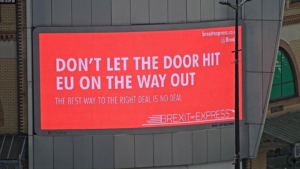 A billboard in Cardiff put up by pro-Leave group Brexit Express, reading: "Don't let the door hit EU on the way out".