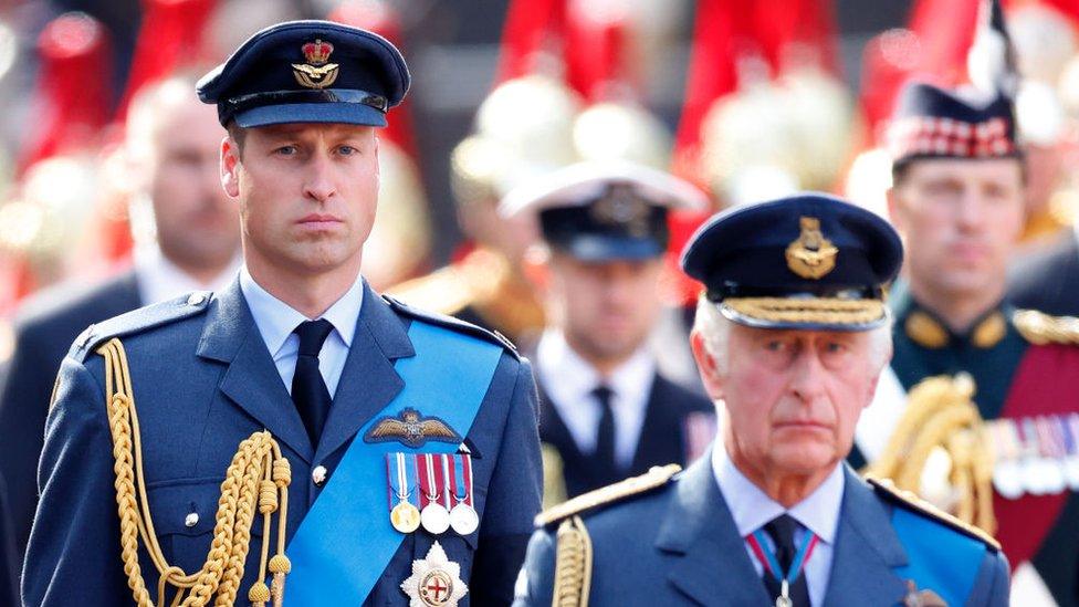 Prince William behind King Charles III.