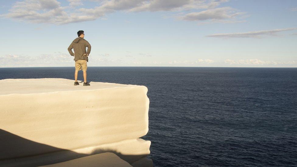 A man standing on Wedding Cake Rock