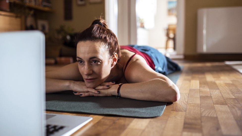 Woman doing yoga at home