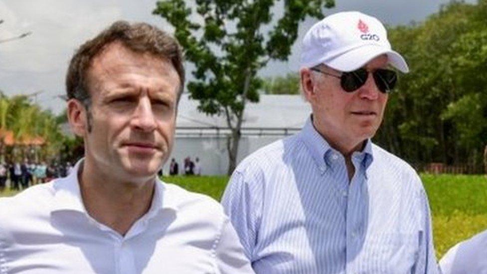 US President Joe Biden (centre) walks with France"s President Emmanuel Macron and International Monetary Fund Managing Director Kristalina Georgieva during their visit to a mangrove conservation forest on the sidelines of the G20 summit meeting, in Bali, Indonesia November 16, 2022.