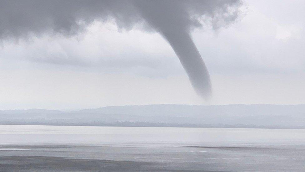 Cylindrical cloud over water