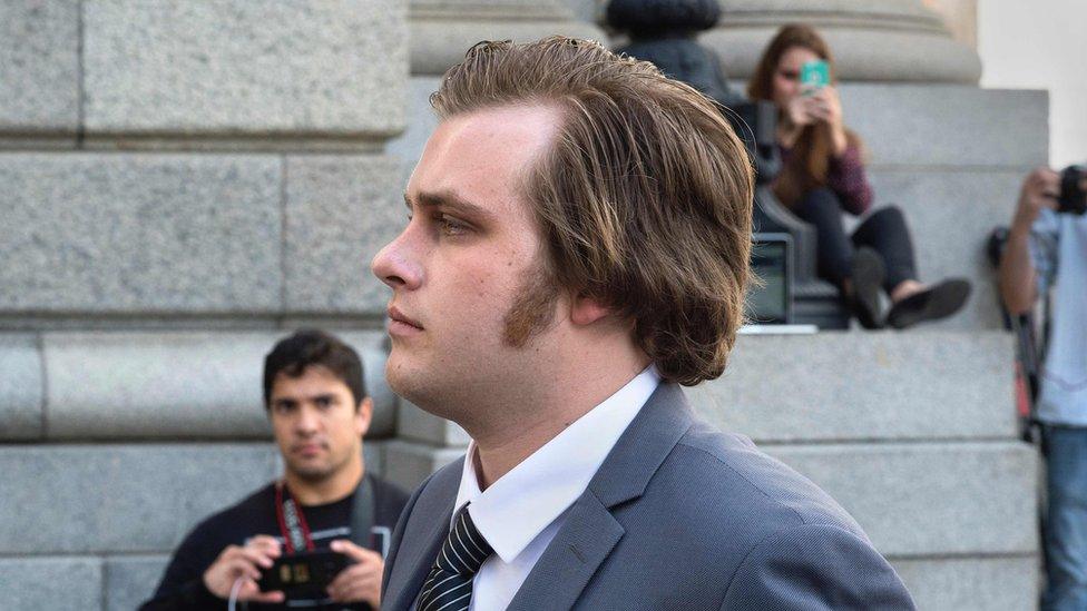 Henri van Breda exits from the Western Cape High Court, after the start of his trial for allegedly killing his two parents, and brother, and wounding his sister, with an axe, in their luxury home, on March 27, 2016, in Cape Town