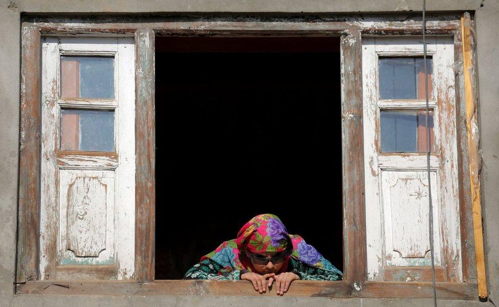 Insha Mushtaq looks out of the window