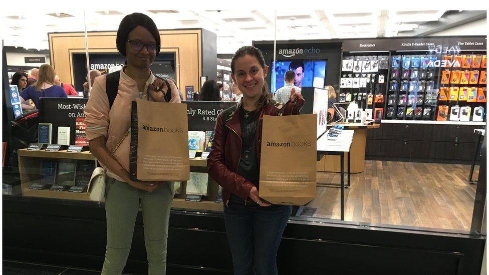 Shoppers outside an Amazon store