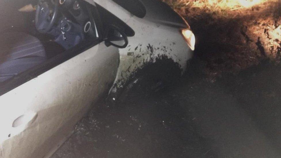 Car stuck in mud