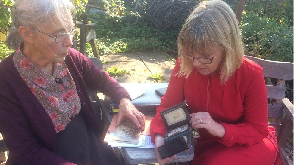 Alison Tyas (left) and Fiona Davison (right) looking at old photos