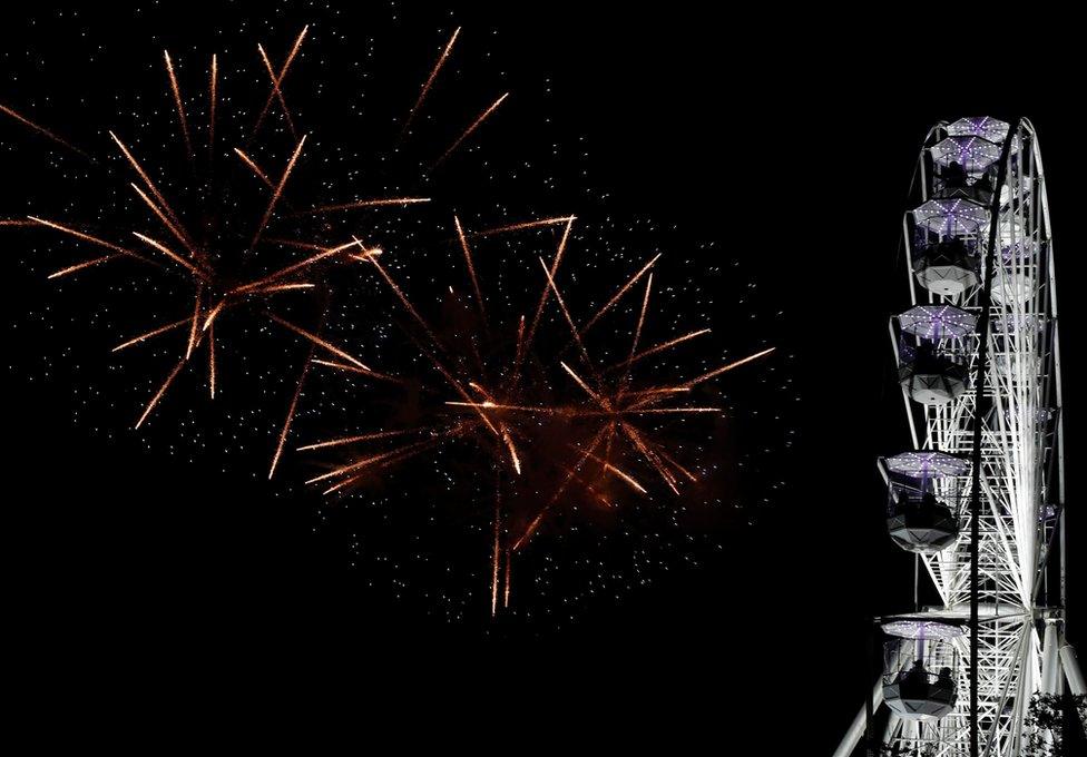 Fireworks explode over the Wheel of Light during Diwali celebrations in Leicester