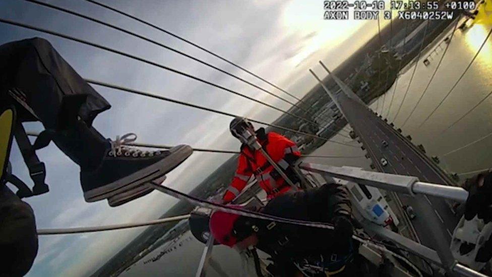 A Just Stop Oil protester at the Dartford Crossing bridge