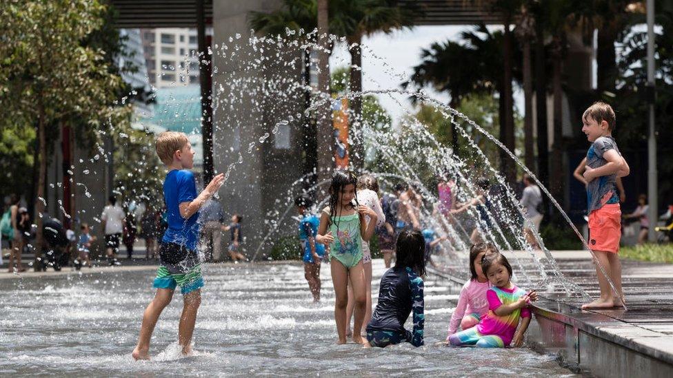 Children playing in fountain