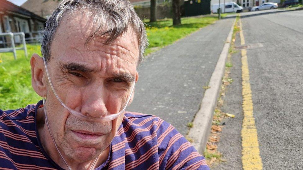 Paul Morgan in front of the single yellow line outside his house