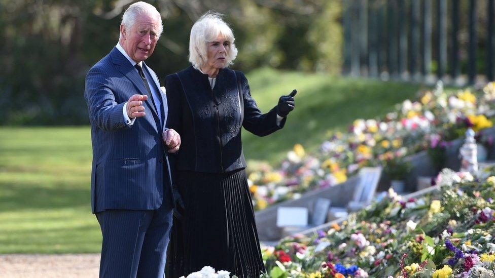 The Prince of Wales and Duchess of Cornwall view flower tributes to Prince Philip at Marlborough House, London, on 15 April 2021