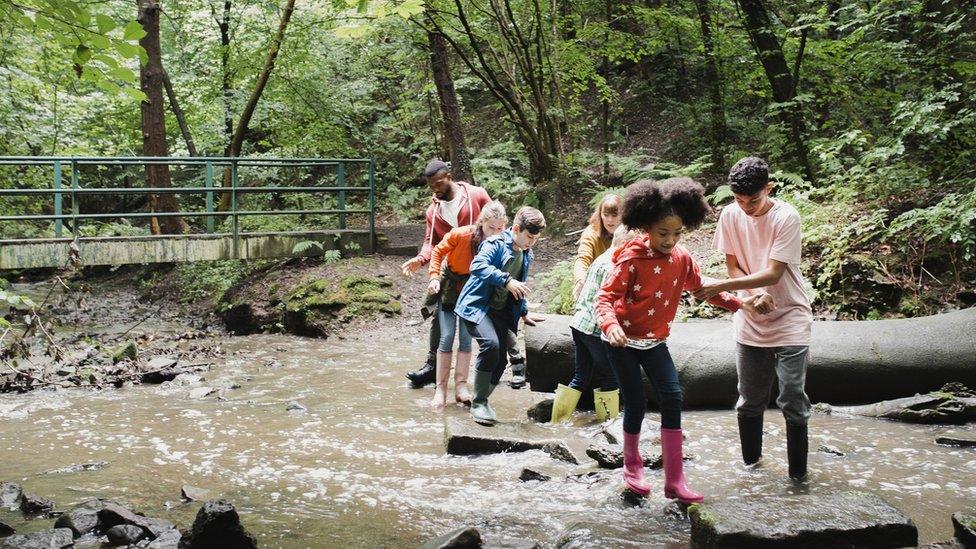 nature-kids-playing-river.