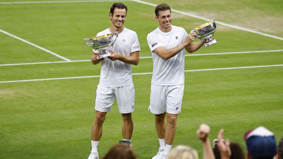 Wesley Koolhof of Netherlands and Neal Skupski of Britain pose with the trophy after winning the Men's Doubles final