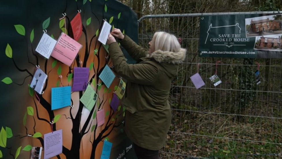 Campaigner pinning a note to memory tree