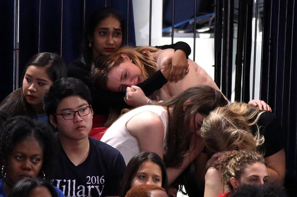 A group of women react as voting results come