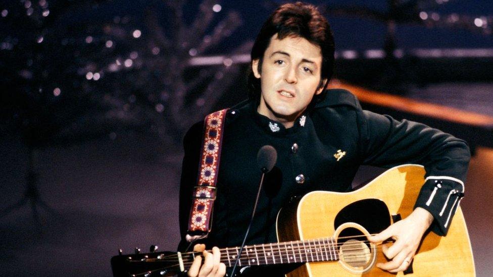 Paul-McCartney-performing-on-stage.