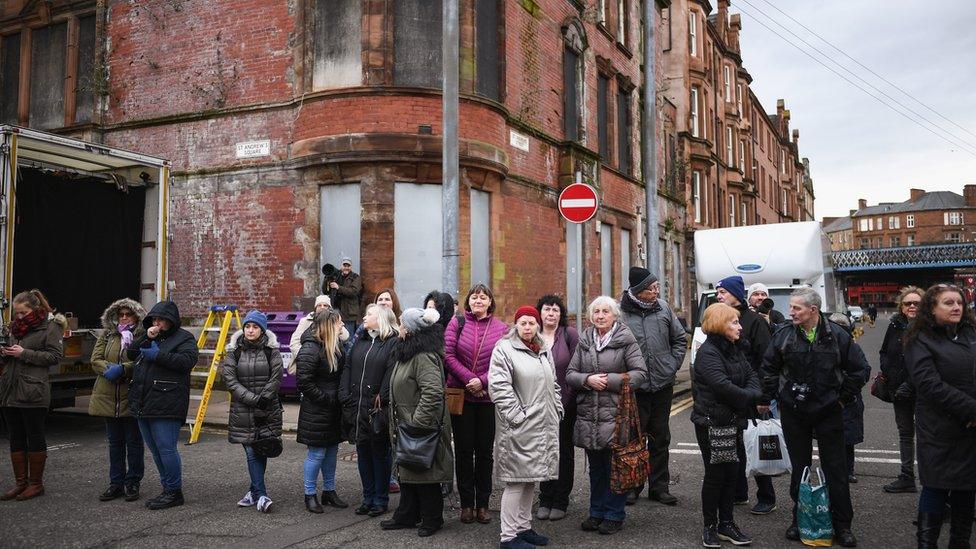 Fans wait for a glimpse of the stars