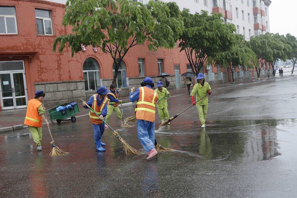 North Korean women sweep the roads on Friday, 6 May 2016, in Pyongyang, North Korea