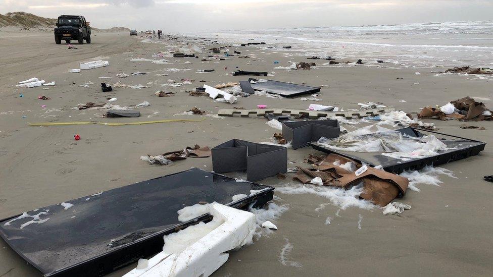 Broken TVs lay on the beach on Terschelling hours after the containers fell into the sea