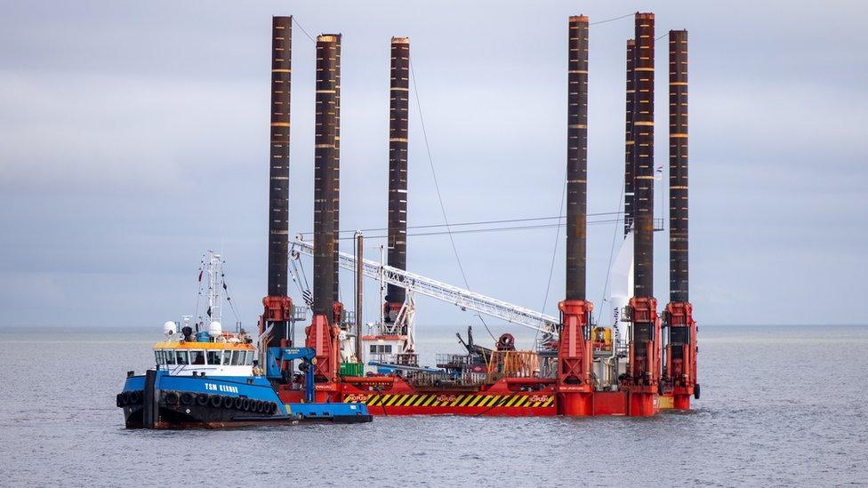 Wavewalker being towed to shore